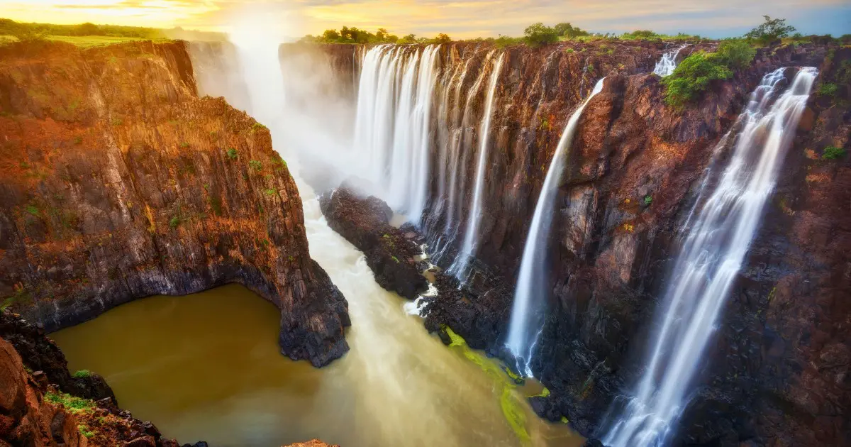 Sunset view of the falls, marking a perfect ending to your Victoria Falls travel guide.