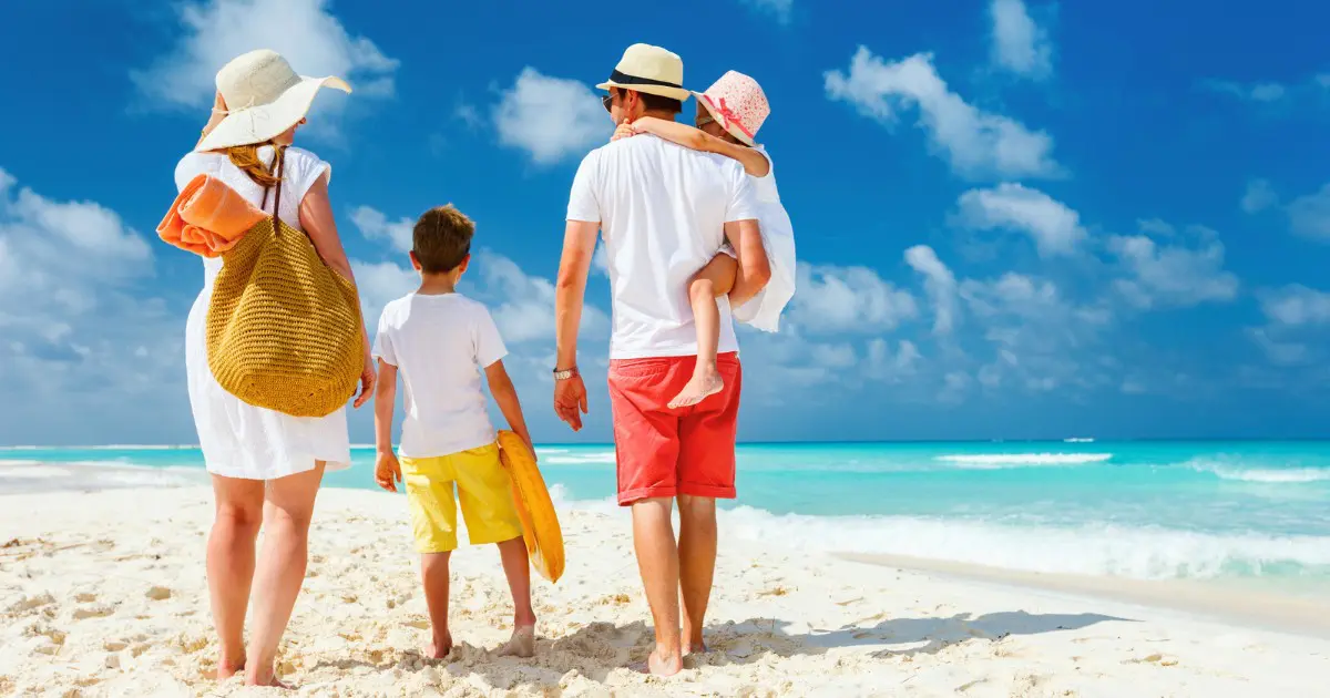 Family enjoying the beach at top family resorts Bahamas offers for vacations.