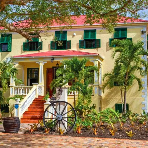 A restored historic plantation house in Barbados with colonial architecture.