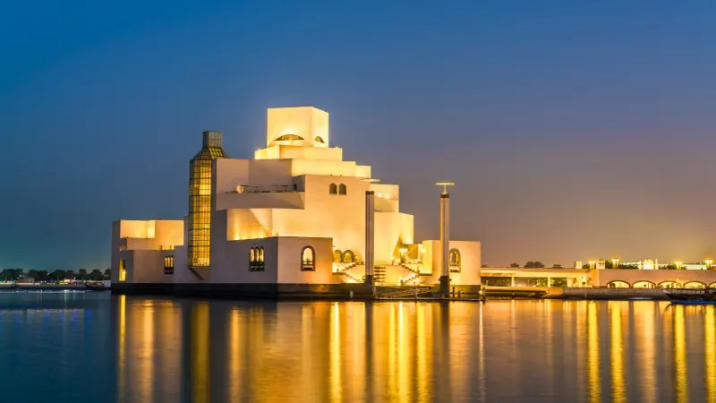 I.M. Pei's Museum of Islamic Art features striking geometric architecture over the water.