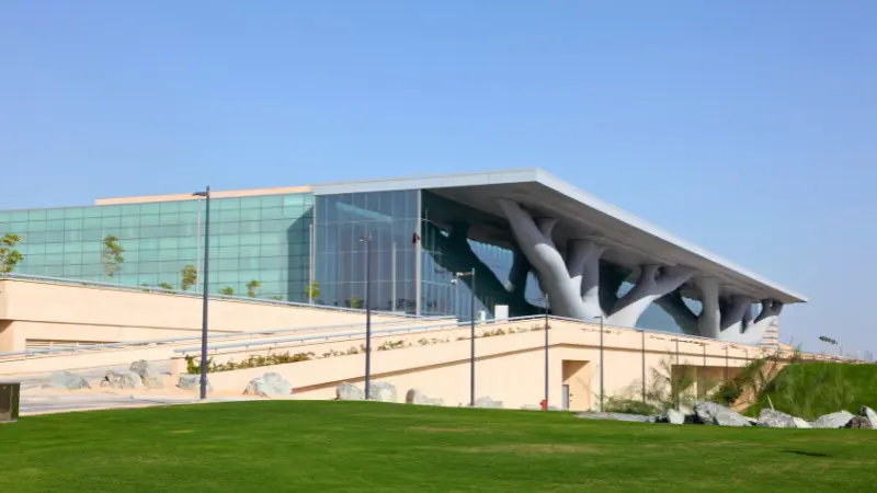 The Qatar Convention Centre features tree-like supports in a modern structure.