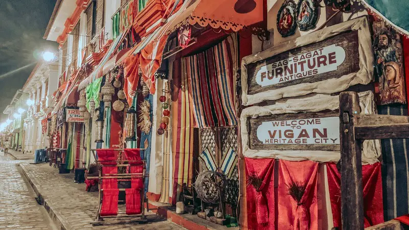 Colorful antique shops along Calle Crisologo in Vigan's heritage area.