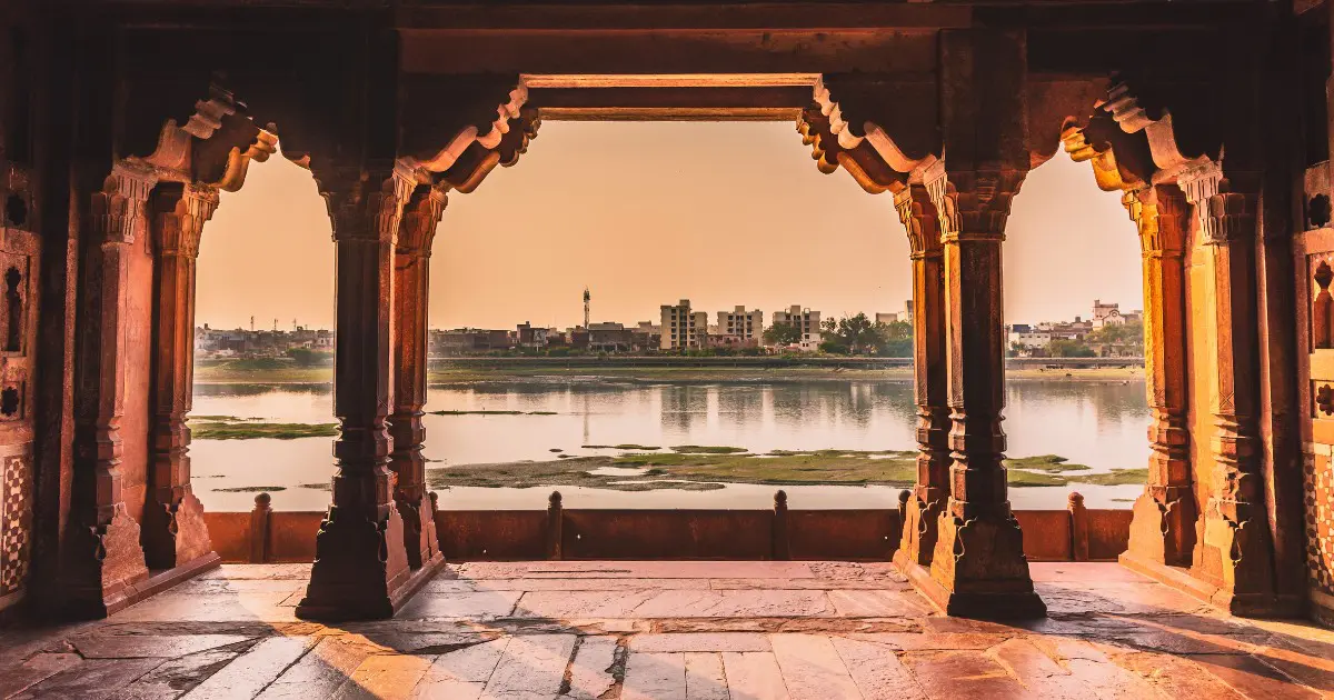 Visitors explore Agra’s Mughal heritage with iconic red sandstone arches.