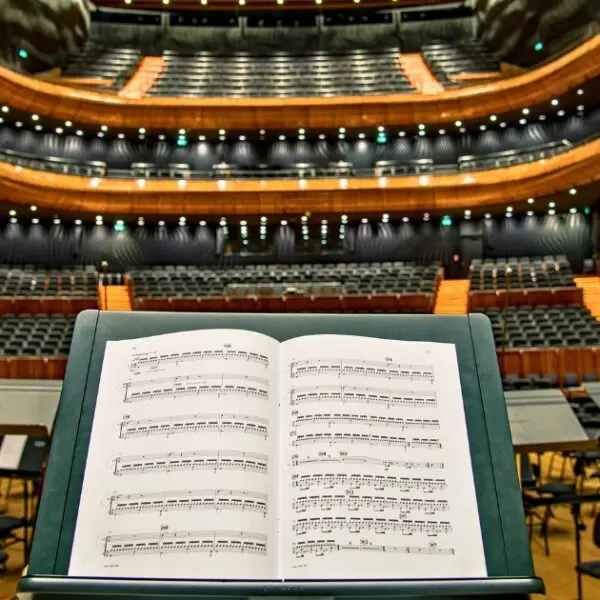 Stage view of a Vienna concert hall with music sheets on a stand.