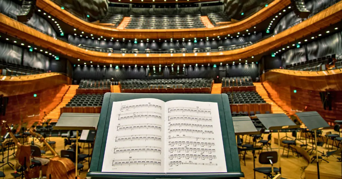 Stage view of a Vienna concert hall with music sheets on a stand.