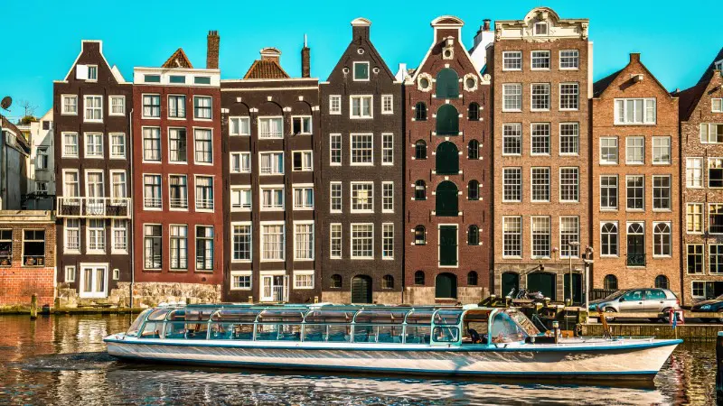Eco-friendly canal boat sailing through Amsterdam, perfect for scenic and quiet trips.