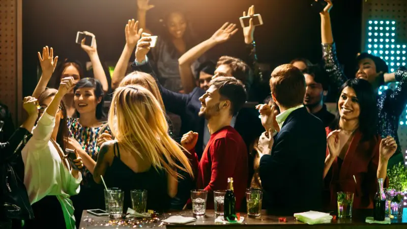 Friends dancing and enjoying a vibrant nightclub in Nicosia.