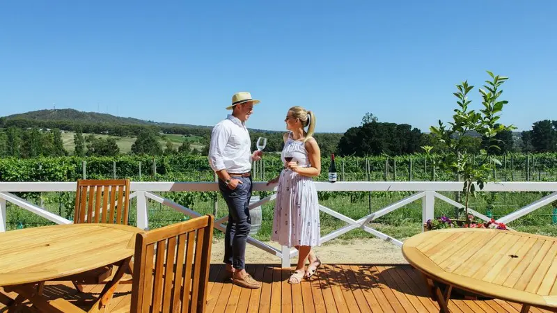 Couple enjoying a glass of wine at Ashton Hills Vineyard in Adelaide Hills.