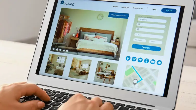 Computer screen shows hotel booking website for redeeming loyalty points.