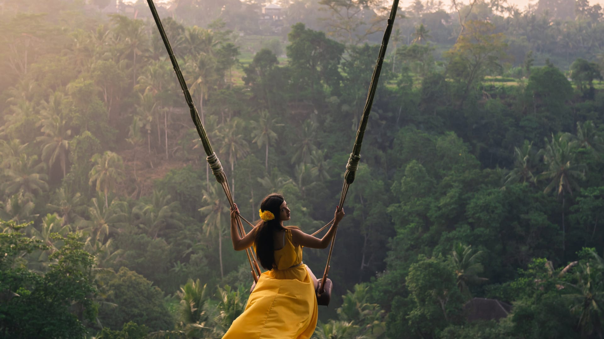 Image of woman on a tree swing in Bali