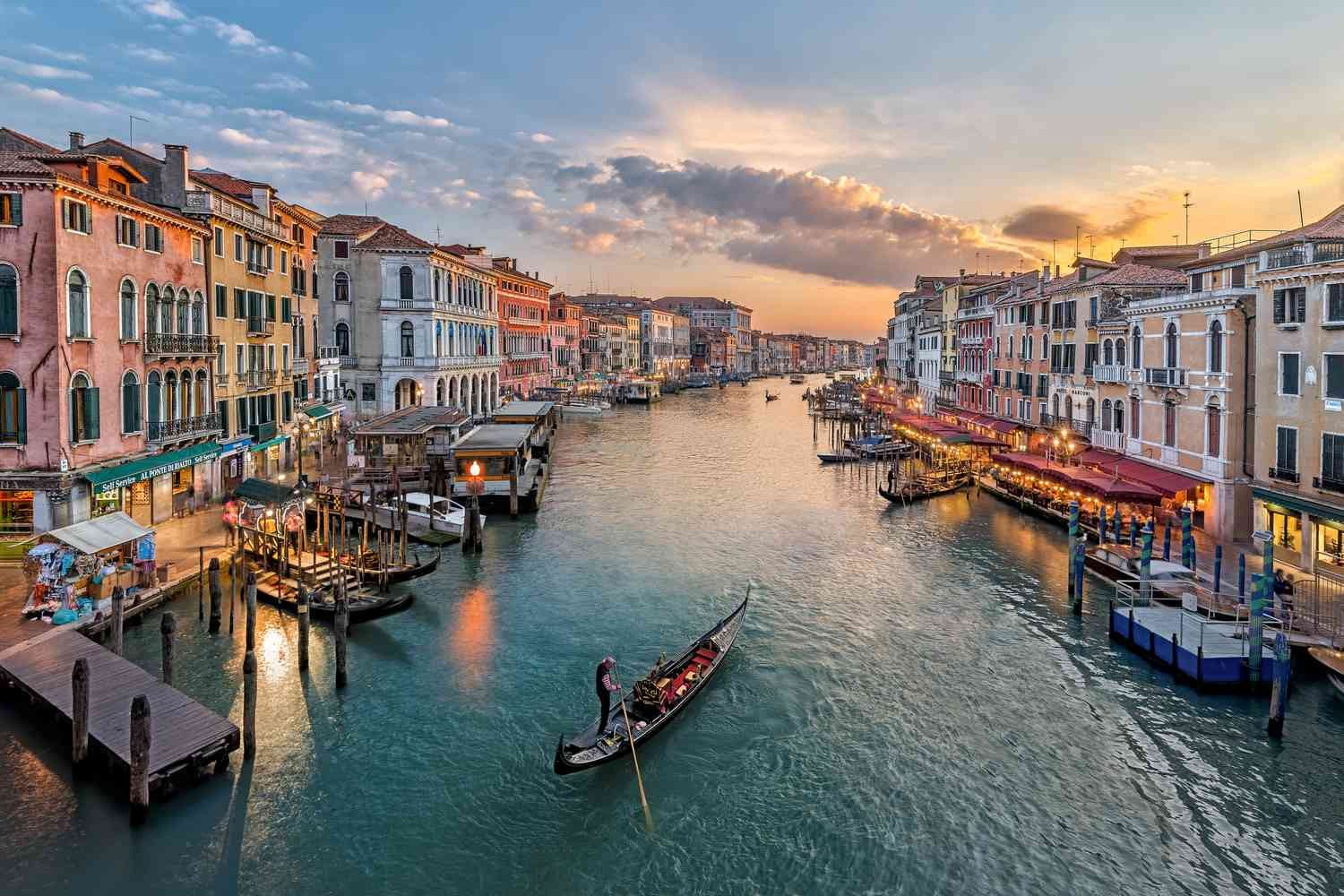 Venice canal with hotels and gondolas