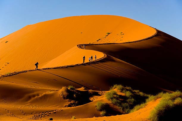 Image of people walking on Dunes