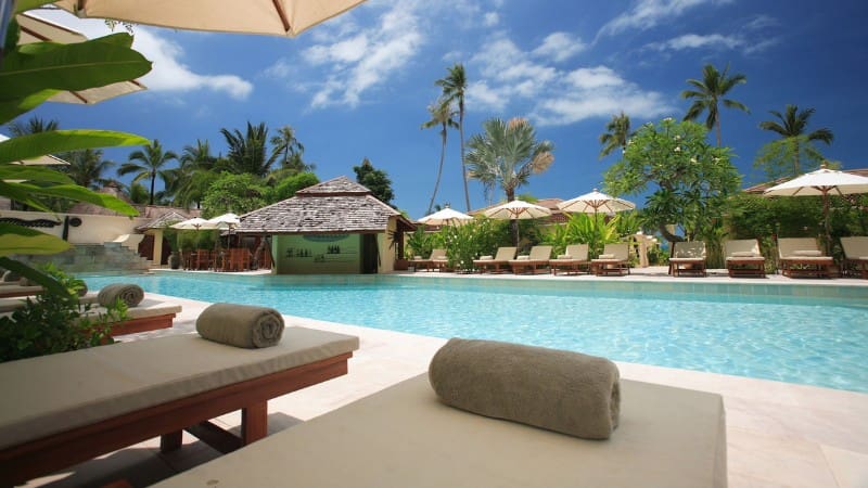 A serene poolside view at an all-inclusive adults-only Fiji resort, perfect for unwinding under the sun.