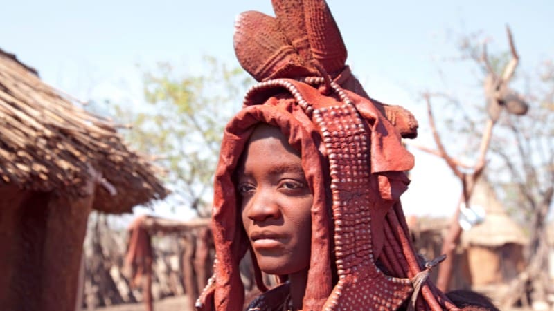 A Himba woman in traditional attire, representing the cultural richness of Namibia.