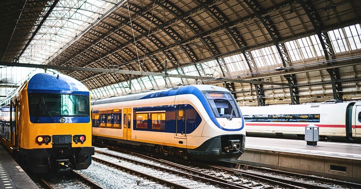 Trains at Amsterdam Centraal Station, showcasing places to visit near Amsterdam by train.
