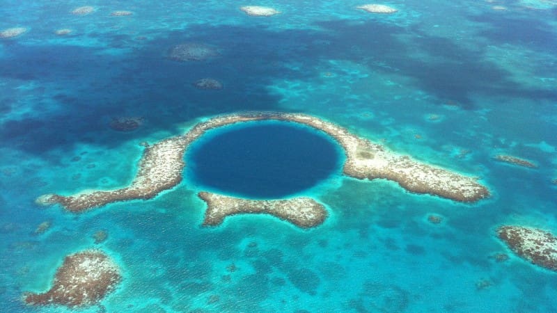 Stunning aerial view highlighting the circular formation of the Great Blue Hole.