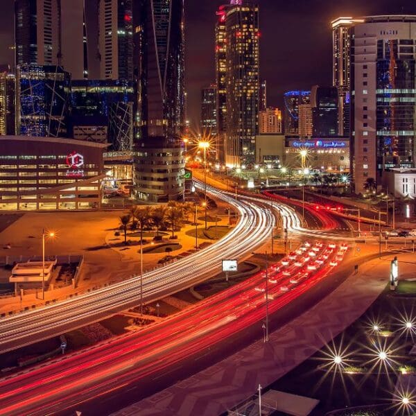 Busy streets and highways at night, showcasing transportation options for getting around Doha.