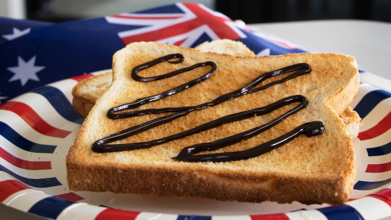 Vegemite on toast with Australian flag, a classic Aussie snack.