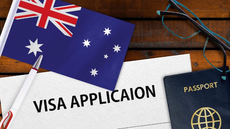 Australia vs New Zealand visa application process with Australian flag and passport.