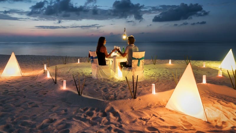 Experience a romantic candlelit dinner on the beach in Seminyak.