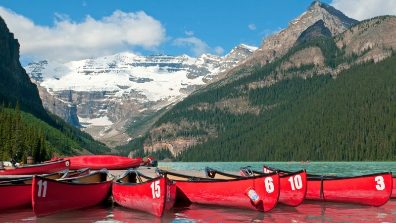 Colorful canoes on Lake Louise, a popular Banff summer activity.