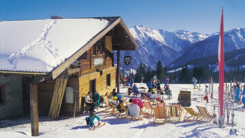 Charming ski lodge at an Austria ski resort with scenic Alpine backdrop