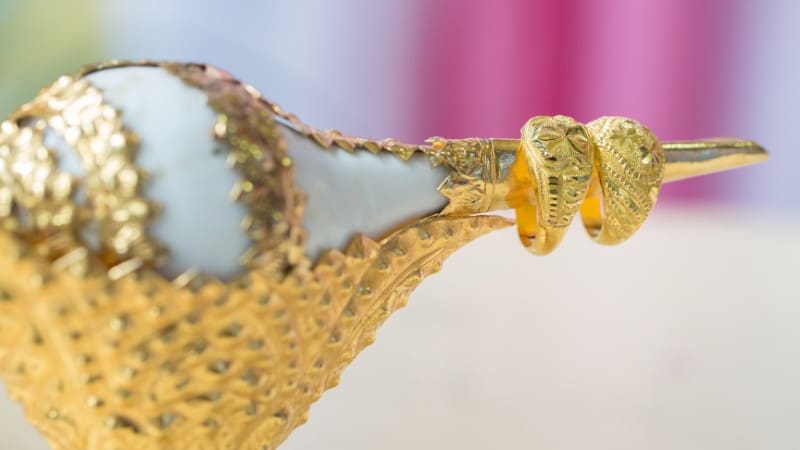 Intricate gold Mayan-inspired jewelry, a luxury Belize souvenir.